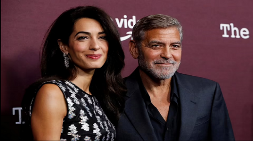 أمل وجورج كلوني في ظهور نادر على السجادة الحمراء.